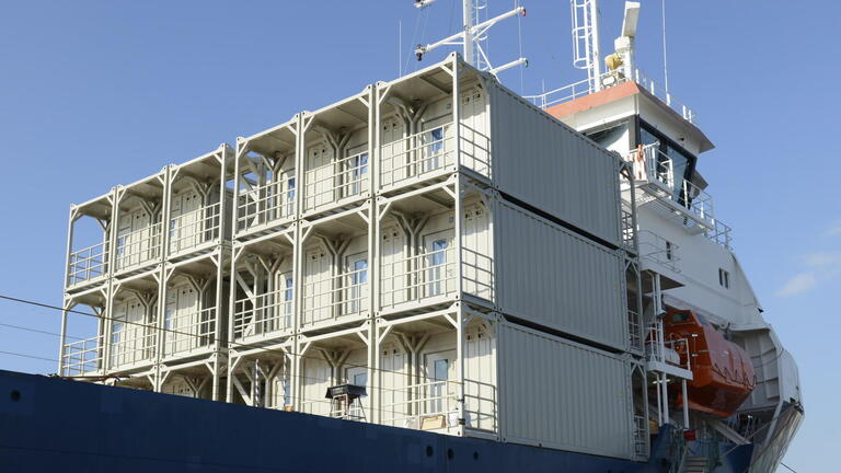 Container onboard a vessel